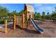 Wooden playground structure with slide and climbing area at 7917 Mainsail Ln, Sarasota, FL 34240