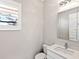 Modern powder room with white vanity and a large mirror at 7917 Mainsail Ln, Sarasota, FL 34240