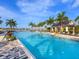 Expansive resort pool with plenty of lounge chairs at 7917 Mainsail Ln, Sarasota, FL 34240