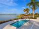 Relax and unwind in this community spa overlooking the lake at 7917 Mainsail Ln, Sarasota, FL 34240