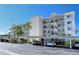 Building exterior with covered parking and landscaping at 797 Beach Rd # 305, Sarasota, FL 34242