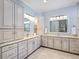 Elegant bathroom with double vanity, granite countertops, and ample storage at 8253 Grande Shores Dr, Sarasota, FL 34240