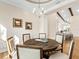 Bright dining room features a rustic round table and six chairs, perfect for gatherings at 8253 Grande Shores Dr, Sarasota, FL 34240