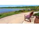 Relaxing lakeside bench with scenic views at 8253 Grande Shores Dr, Sarasota, FL 34240