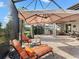 Outdoor patio furniture with umbrella and view at 8253 Grande Shores Dr, Sarasota, FL 34240