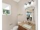 Convenient powder room with granite countertop and updated fixtures at 8253 Grande Shores Dr, Sarasota, FL 34240