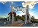 Community entrance with an archway, floral accents, and views of the marina at 850 S Tamiami Trl # 408, Sarasota, FL 34236