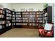 Community library room with floor-to-ceiling bookshelves filled with a vast collection of books at 850 S Tamiami Trl # 408, Sarasota, FL 34236