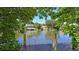 Waterfront property featuring a dock with views of neighboring houses along the canal at 850 S Tamiami Trl # 408, Sarasota, FL 34236