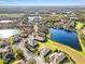 Aerial view of home near a lake in a community at 9109 Winter Harbour Way, Bradenton, FL 34212