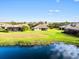 Aerial view of home with lake and conservation views at 9109 Winter Harbour Way, Bradenton, FL 34212