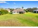 Home's backyard features a large grassy area at 9109 Winter Harbour Way, Bradenton, FL 34212