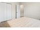 Bright bedroom with a double door closet and view to hallway at 9109 Winter Harbour Way, Bradenton, FL 34212