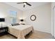 Bedroom with ceiling fan, window, and ample floor space at 9109 Winter Harbour Way, Bradenton, FL 34212