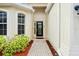 Front entry with paver walkway, and decorative glass door at 9109 Winter Harbour Way, Bradenton, FL 34212