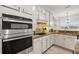 Stainless steel appliances and white shaker cabinets in this kitchen at 9109 Winter Harbour Way, Bradenton, FL 34212