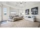 Living room with sectional sofa, light colored rug, and large windows at 9109 Winter Harbour Way, Bradenton, FL 34212