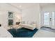 Living area featuring a neutral sofa, glass coffee table, and decorative accents at 9109 Winter Harbour Way, Bradenton, FL 34212