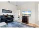 Music room with piano and plenty of natural light at 9109 Winter Harbour Way, Bradenton, FL 34212