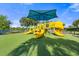 Modern playground with slides and play structure under a shaded canopy at 9109 Winter Harbour Way, Bradenton, FL 34212