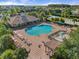 Community pool with lounge chairs and playground at 9109 Winter Harbour Way, Bradenton, FL 34212