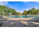 Relaxing pool area with lounge chairs and shade at 9109 Winter Harbour Way, Bradenton, FL 34212