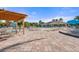 Poolside patio with tables, chairs, and pergola at 9109 Winter Harbour Way, Bradenton, FL 34212