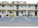 Condo building showcasing multiple entrances and parking at 972 La Costa Cir # 5, Sarasota, FL 34237