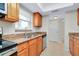 Full kitchen view with ample cabinetry and counter space at 972 La Costa Cir # 5, Sarasota, FL 34237