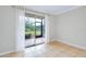 Living area with tile floors and sliding glass doors to a patio at 972 La Costa Cir # 5, Sarasota, FL 34237