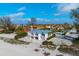 Beachfront property aerial view, white building, adjacent buildings and beach visible at 100 73Rd St # 104A, Holmes Beach, FL 34217