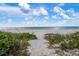 Path to beach through lush vegetation at 100 73Rd St # 104A, Holmes Beach, FL 34217