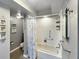 Bathroom with tub, shower, and updated fixtures at 10190 Imperial Point W Dr # 16, Largo, FL 33774