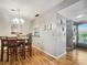 Dining area with wood floors and pass-through to kitchen at 10190 Imperial Point W Dr # 16, Largo, FL 33774