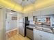 Kitchen with stainless steel appliances and light wood flooring at 10190 Imperial Point W Dr # 16, Largo, FL 33774