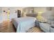 Spacious bedroom with king-size bed and en-suite bathroom at 10190 Imperial Point W Dr # 16, Largo, FL 33774