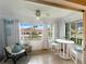Sunroom with view, table, and chairs and plenty of natural light at 10190 Imperial Point W Dr # 16, Largo, FL 33774