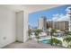 Private balcony overlooking the city and resort-style pool at 111 S Pineapple Ave # 708, Sarasota, FL 34236
