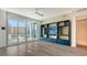 Living room features built-in shelving, balcony access, and hardwood floors at 111 S Pineapple Ave # 708, Sarasota, FL 34236