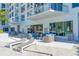 Modern pool deck with comfortable seating and a pergola at 111 S Pineapple Ave # 708, Sarasota, FL 34236