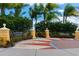 Landscaped park entrance with a seating area at 12426 Tranquility Park Ter, Bradenton, FL 34211