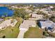 Aerial view of single-story home with large backyard, located on a lake at 1312 Lucaya Ave, Venice, FL 34285