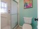 Clean bathroom featuring a shower and toilet at 1312 Lucaya Ave, Venice, FL 34285