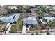 Aerial view of a light blue home and surrounding homes at 141 N Adams Dr, Sarasota, FL 34236