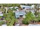 Aerial view of a light blue home with a large backyard at 141 N Adams Dr, Sarasota, FL 34236