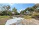 Large backyard with patio and tropical landscaping at 141 N Adams Dr, Sarasota, FL 34236