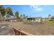 Large backyard with mature tropical trees at 141 N Adams Dr, Sarasota, FL 34236