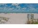 Public beach access with white sand and blue water at 141 N Adams Dr, Sarasota, FL 34236