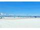 Expansive beach view with umbrellas and beachgoers at 141 N Adams Dr, Sarasota, FL 34236