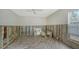 Renovation needed: Bedroom with wood floors and window at 141 N Adams Dr, Sarasota, FL 34236